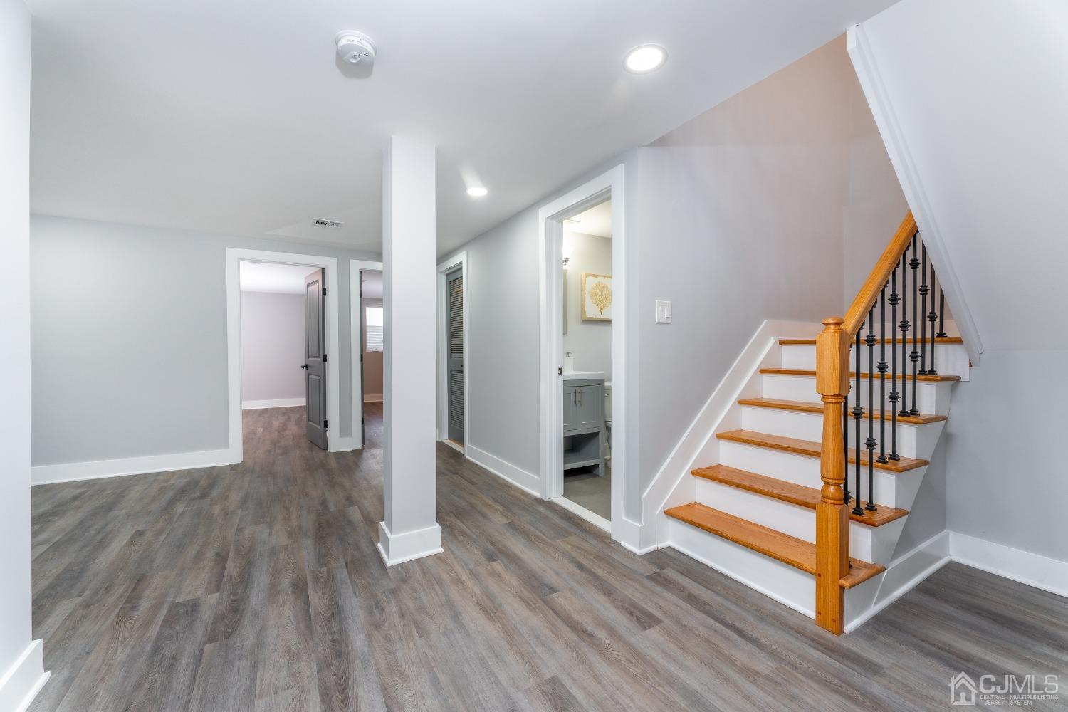 45 East Cliff Road Colonia, NJ 07067 - Photo 23 of 31 a view of a hallway with wooden floor and stairs
