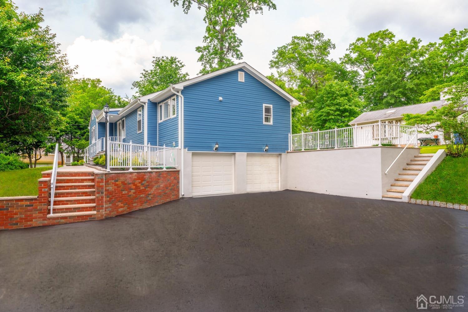 45 East Cliff Road Colonia, NJ 07067 - Photo 27 of 31 a front view of a house with a yard