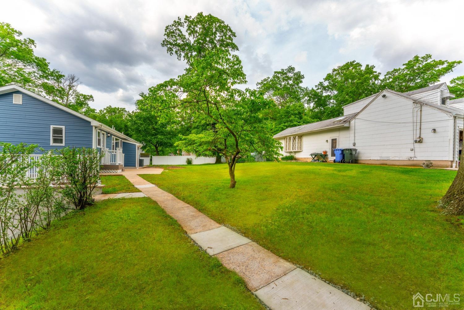45 East Cliff Road Colonia, NJ 07067 - Photo 28 of 31 a view of a house with a yard