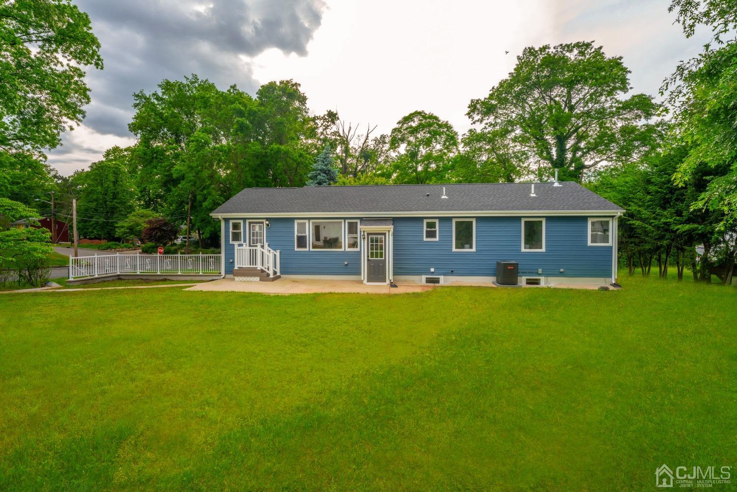 45 East Cliff Road Colonia, NJ 07067 - Photo 31 of 31 a front view of a house with a garden