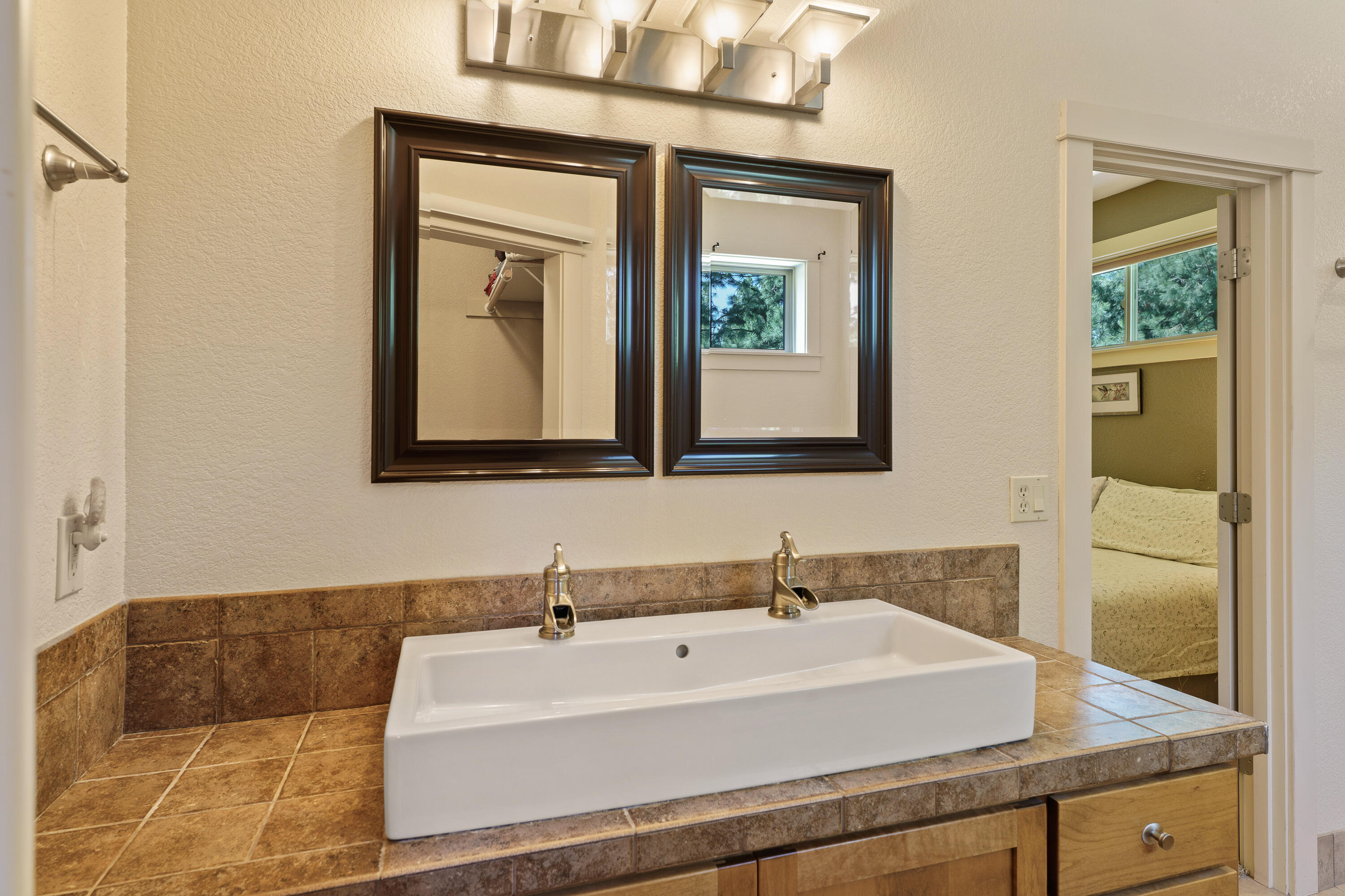 19236 Kiowa Road Bend, OR 97702 - Photo 25 of 52 a bathroom with a sink and a mirror