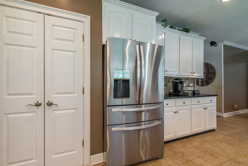 1408 Beaverdale Road Dalton, GA 30721 - Photo 19 of 51 a kitchen with stainless steel appliances and refrigerator