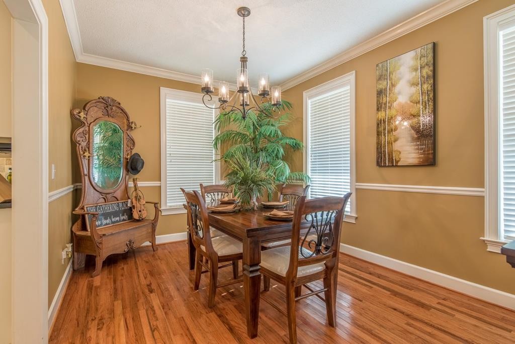 1408 Beaverdale Road Dalton, GA 30721 - Photo 24 of 51 a view of a dining room with furniture window and wooden floor