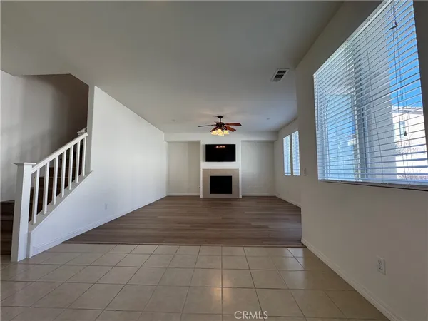 a view of a hallway with a kitchen