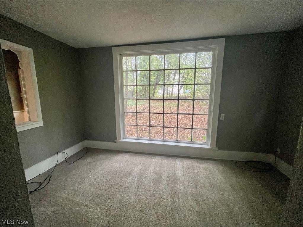 857 Aberdeen Street Akron, OH 44310 - Photo 10 of 23 Carpeted spare room with a textured ceiling