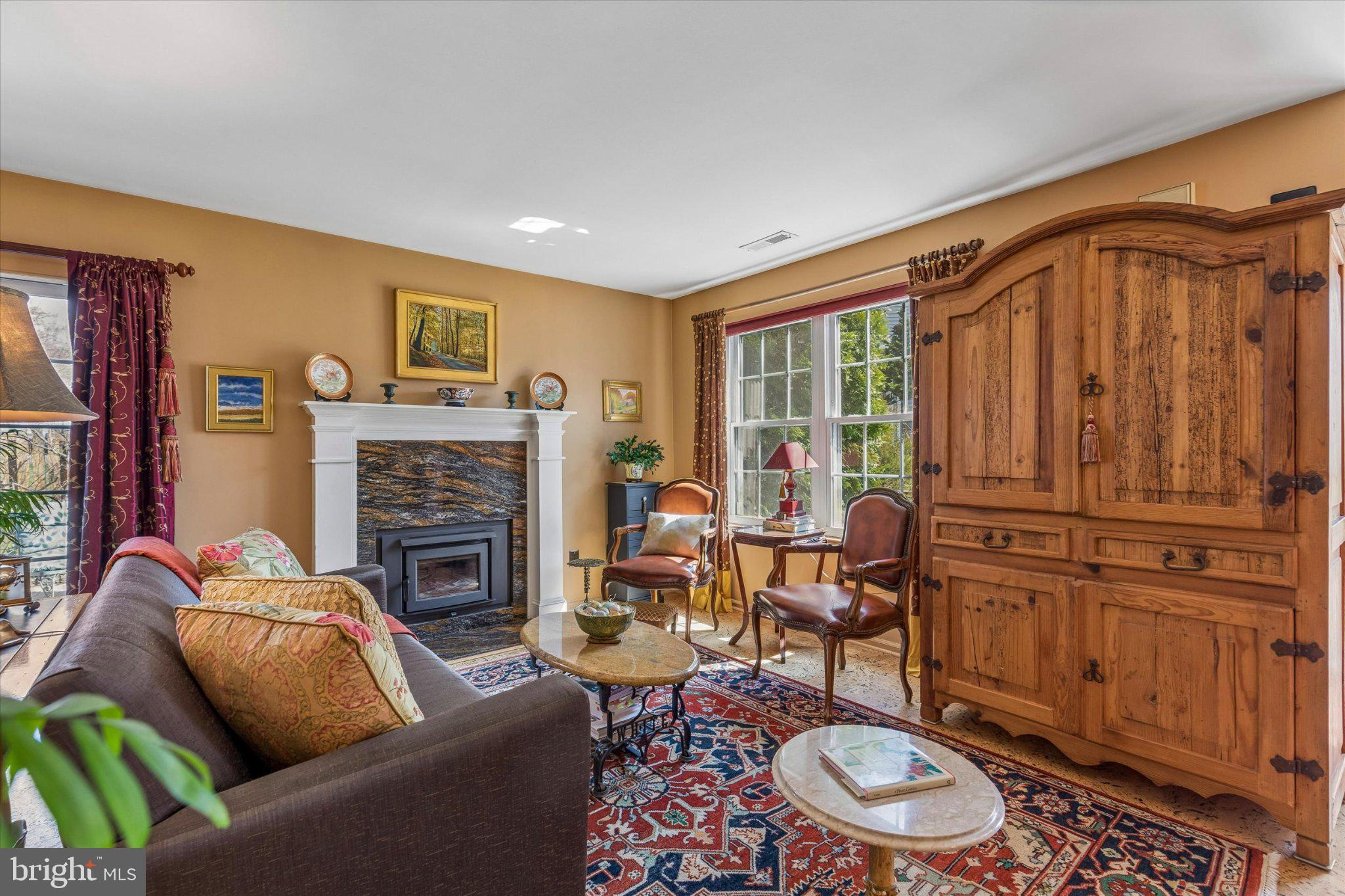 107 Carousel Circle Doylestown, PA 18901 - Photo 5 of 31 a living room with furniture a fireplace and a window
