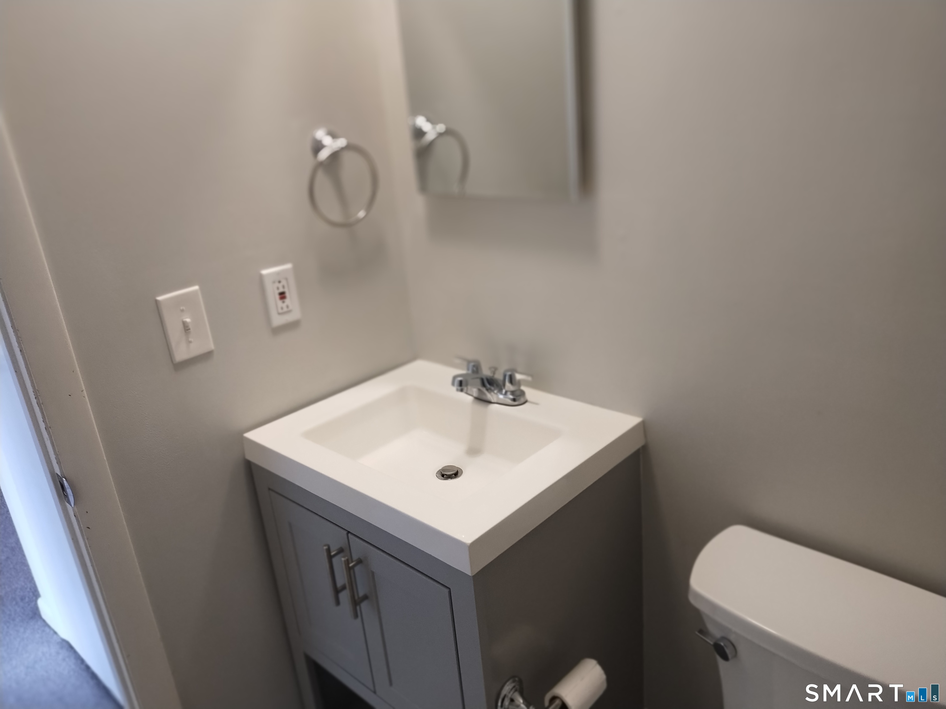 115 Short Beach Road, Unit 307 Stratford, CT 06615 - Photo 19 of 32 a bathroom with a sink and a toilet