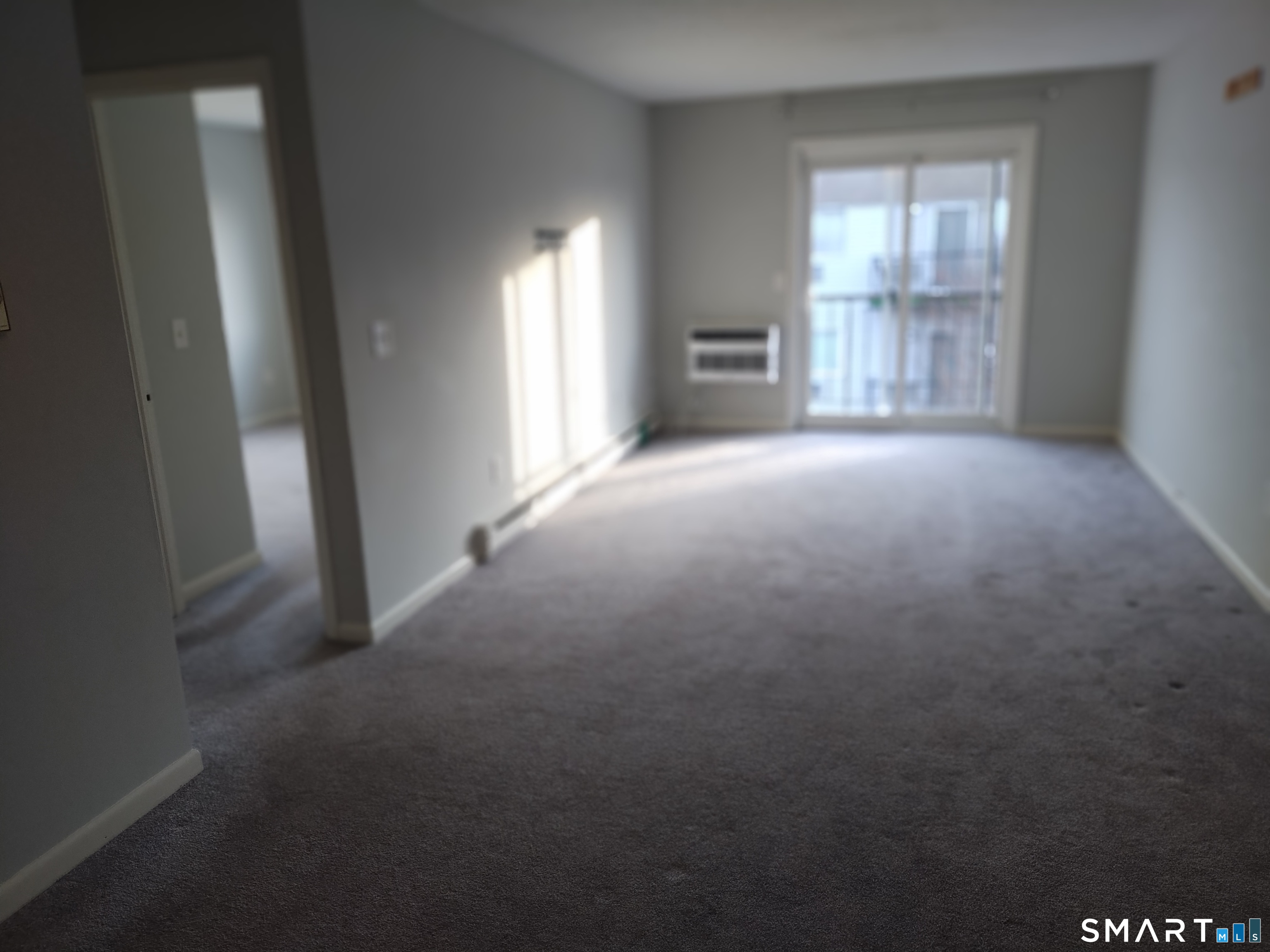 115 Short Beach Road, Unit 307 Stratford, CT 06615 - Photo 5 of 32 a view of empty room with windows