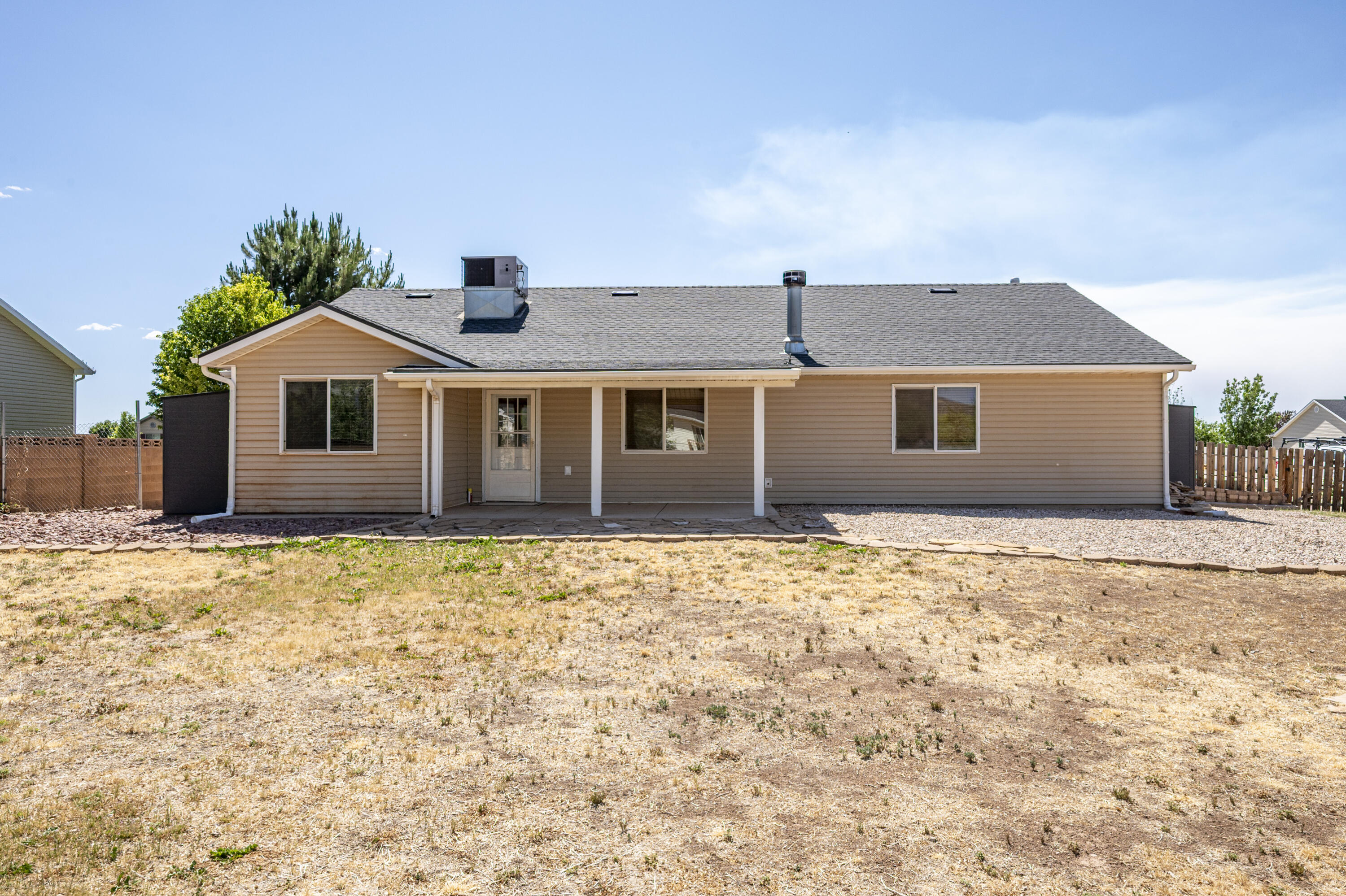 4510 North Half Mile Road Cedar City, UT 84721 - Photo 33 of 48 The west-facing orientation provides a naturally shaded backyard in the summer, making the outdoor space more comfortable and enjoyable.