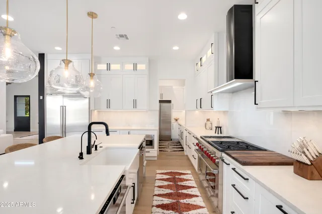 a white stove top oven sitting inside of a kitchen