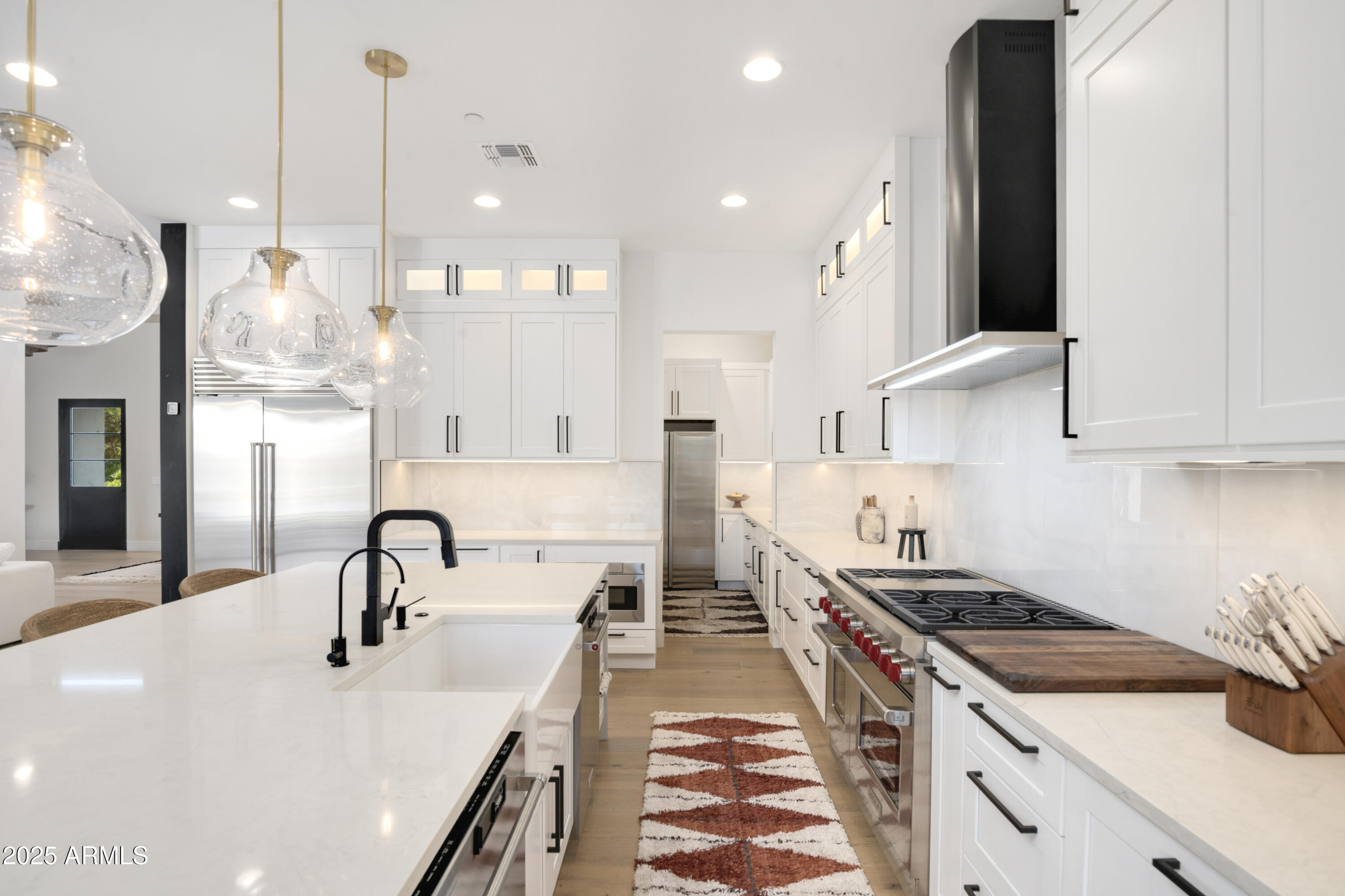 2912 East Pierson Street Phoenix, AZ 85016 - Photo 11 of 39 a kitchen with stainless steel appliances granite countertop a sink a stove and a refrigerator