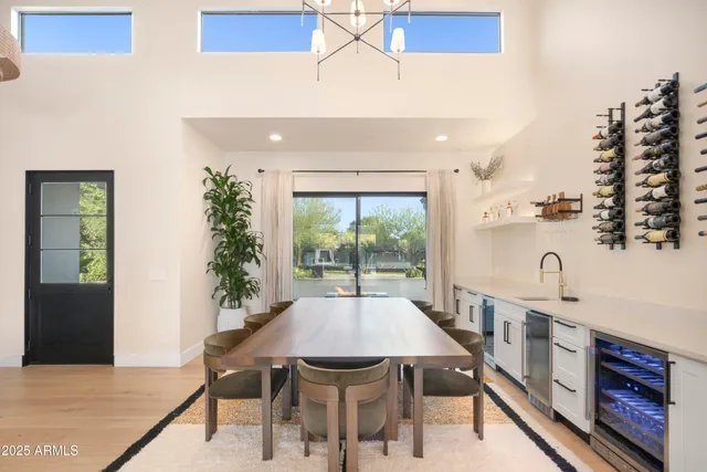 a kitchen with stainless steel appliances granite countertop a sink a stove and a refrigerator