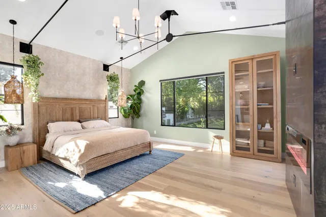 a room with pool table and windows