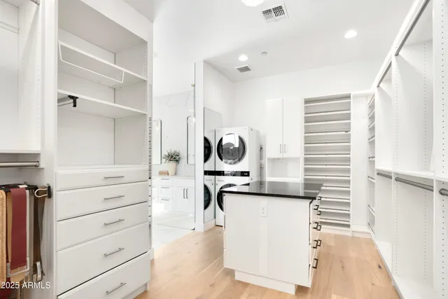 a bathroom with a bathtub shower sink and mirror