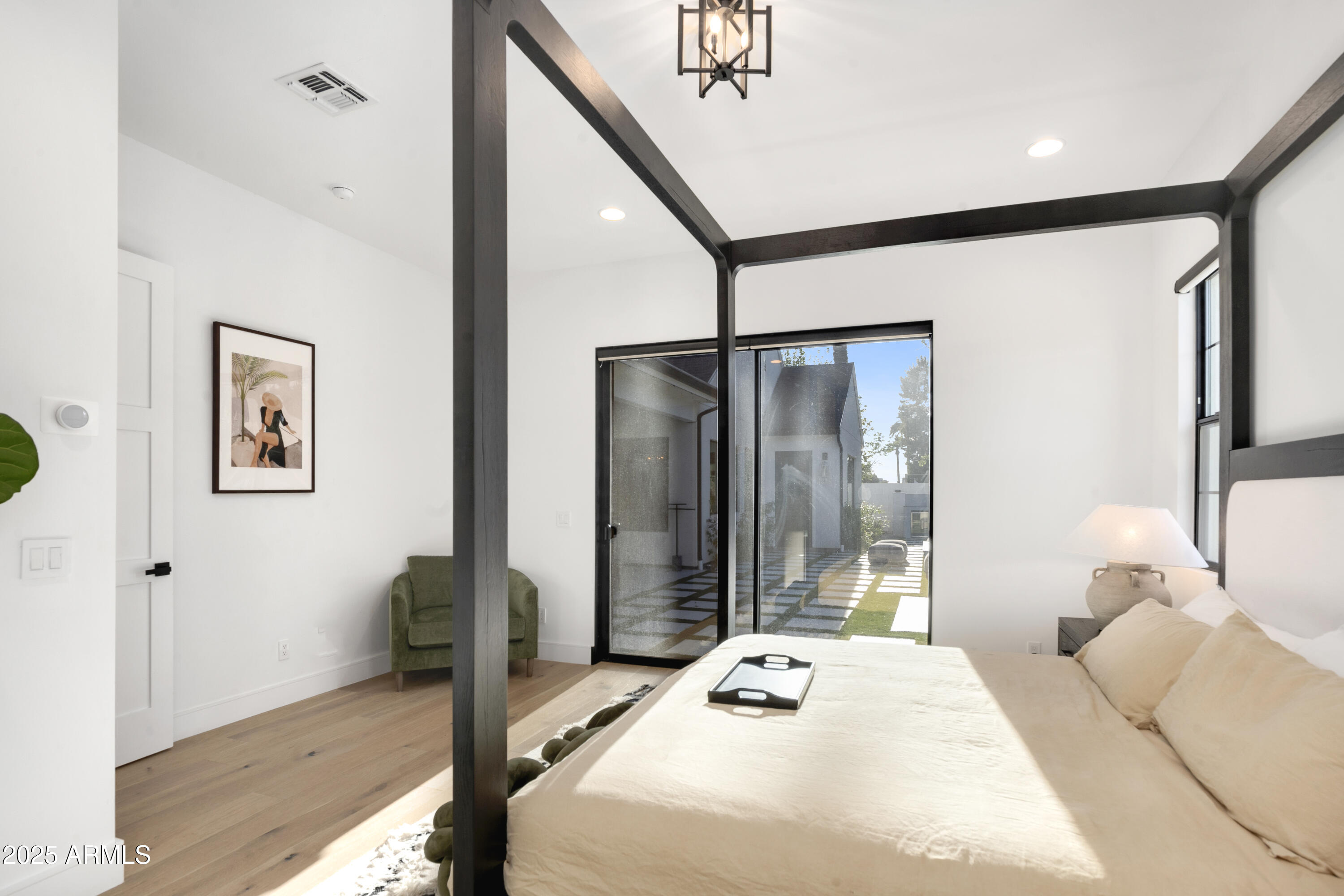 2912 East Pierson Street Phoenix, AZ 85016 - Photo 25 of 39 a bedroom with a bed and a large mirror