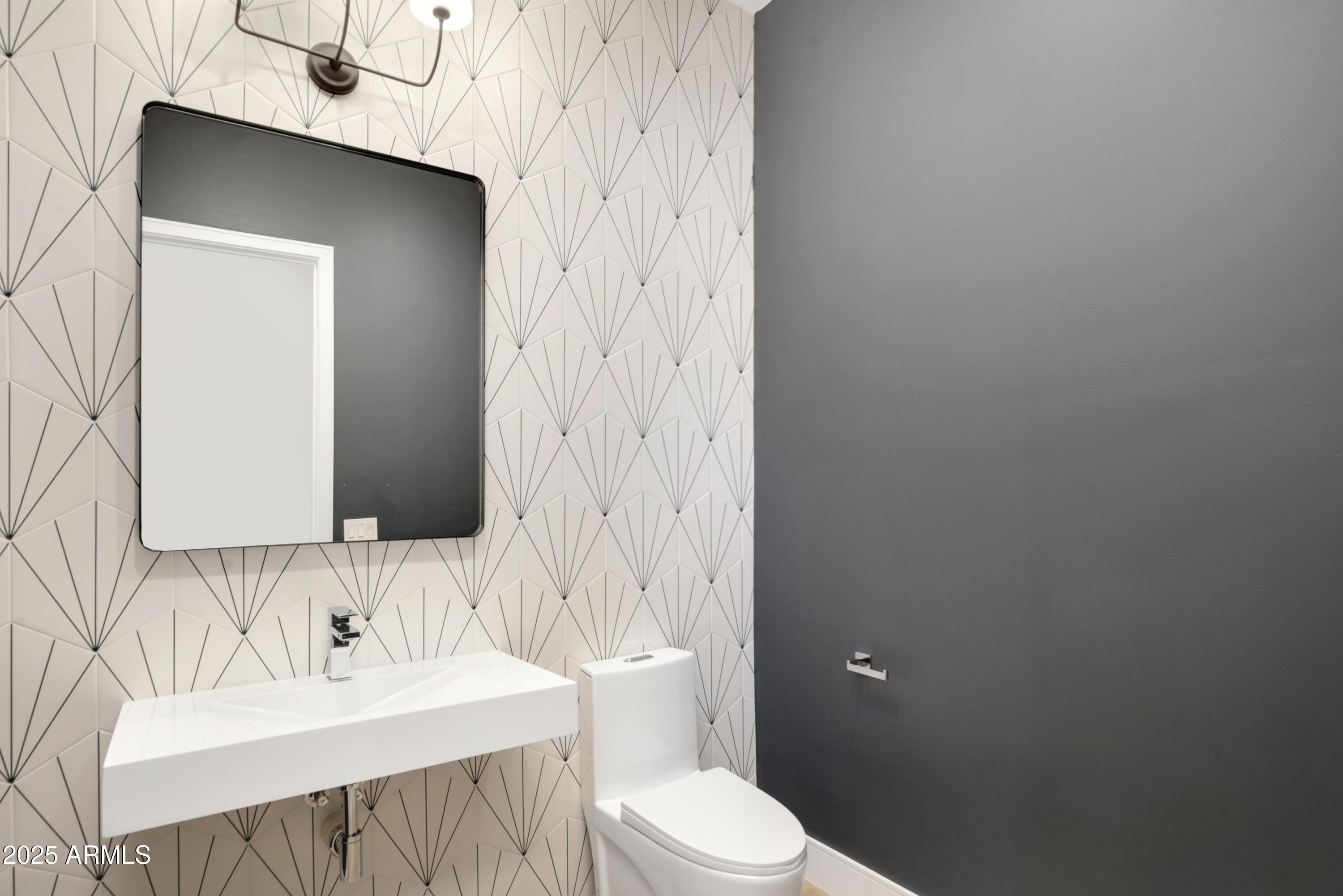 2912 East Pierson Street Phoenix, AZ 85016 - Photo 28 of 39 a bathroom with a sink a toilet and mirror