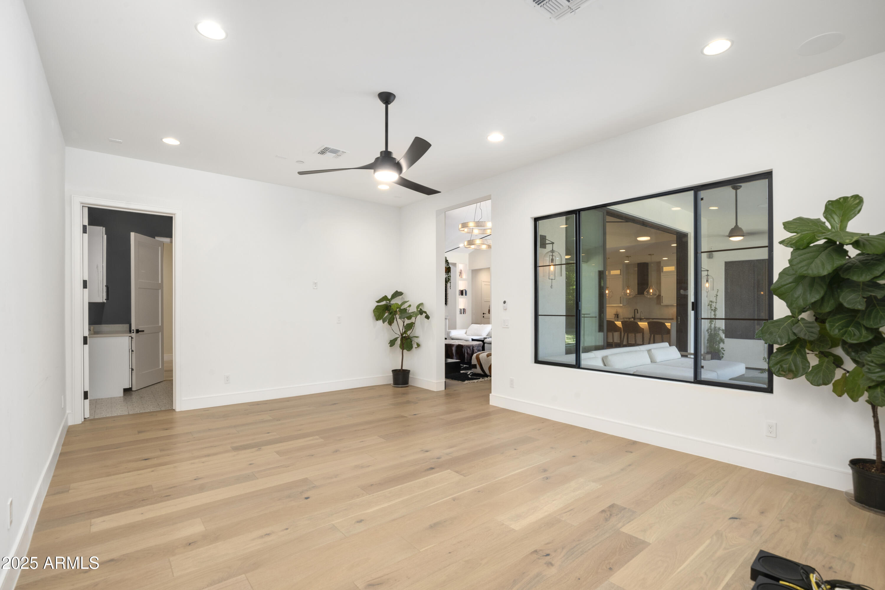 2912 East Pierson Street Phoenix, AZ 85016 - Photo 29 of 39 a view of a big room with a potted plant and windows