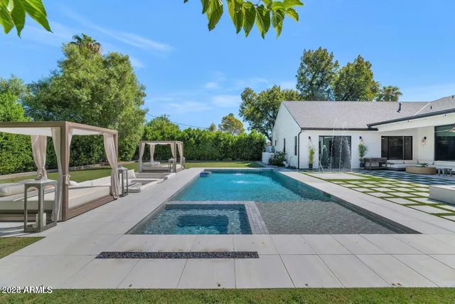 a view of a swimming pool with a yard