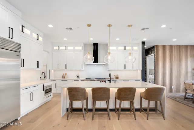 a very nice looking living room with a large window and furniture