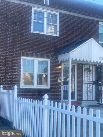 a front view of a house with a porch