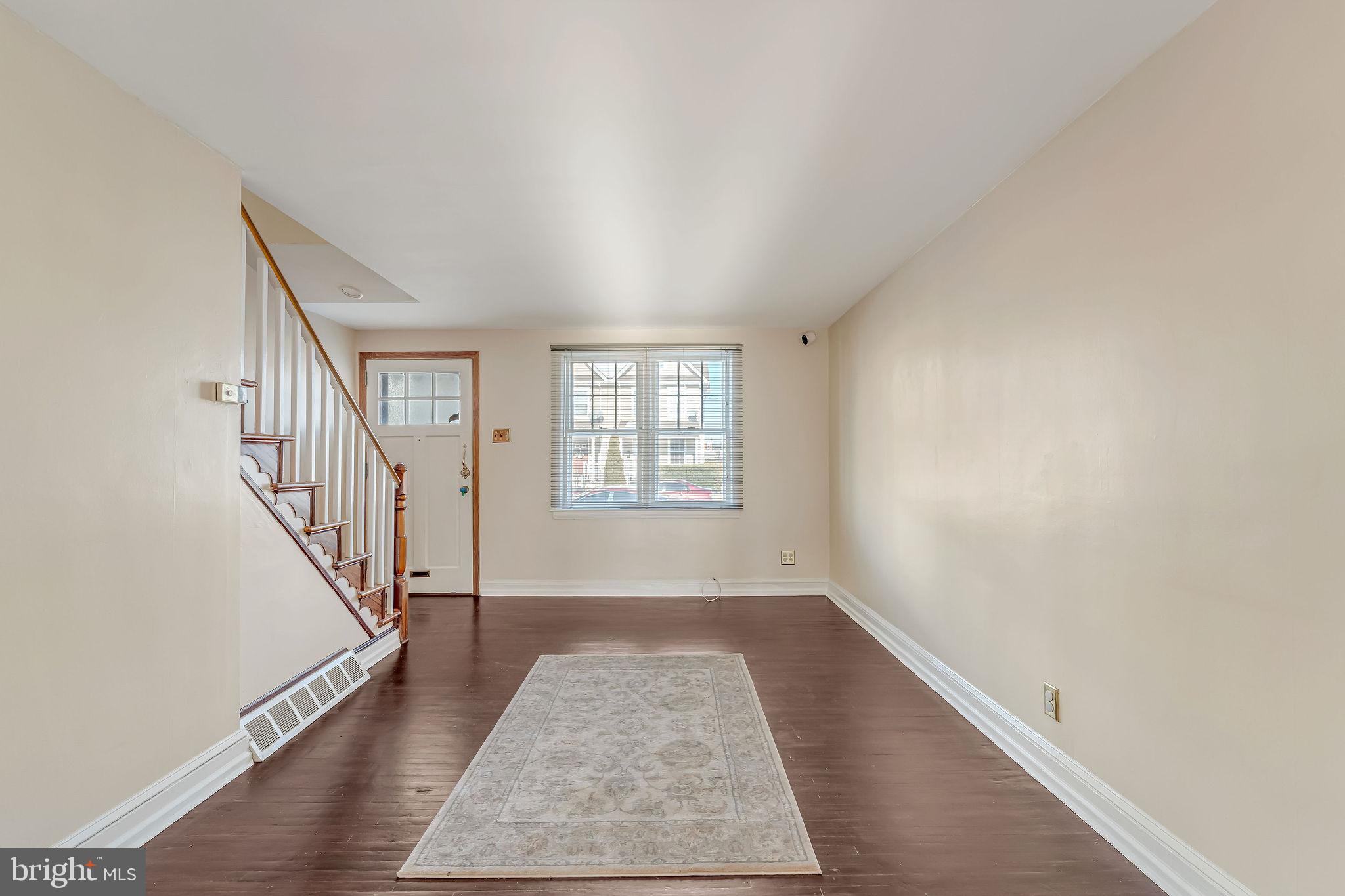 1105 North 21st Street Camden, NJ 08105 - Photo 3 of 15 wooden floor in an empty room with a window