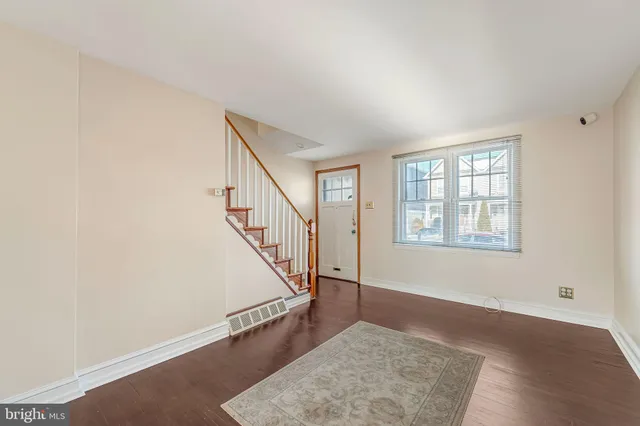 a view of an entryway with wooden floor