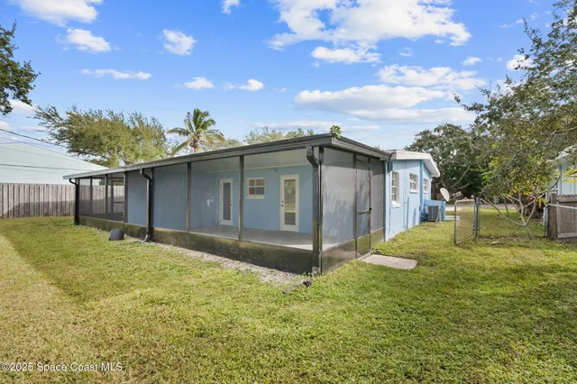 a view of a kitchen with a sink and cabinets