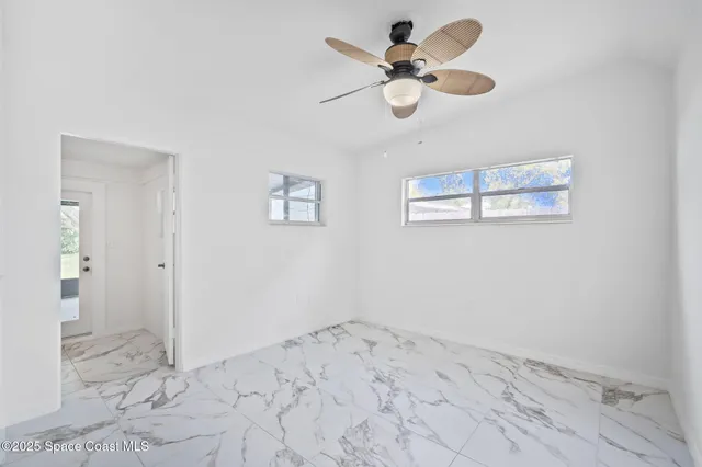 a view of an empty room and window