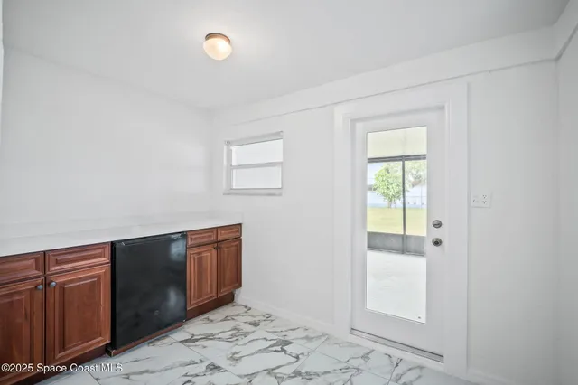 a view of an empty room with a large window
