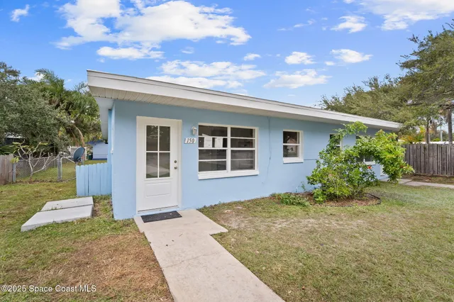 a kitchen with stainless steel appliances kitchen island granite countertop a refrigerator and a sink