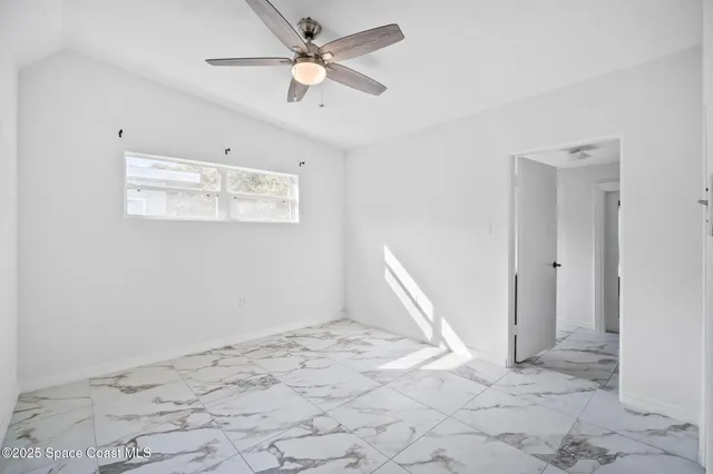 a hallway with sliding door and wooden floor