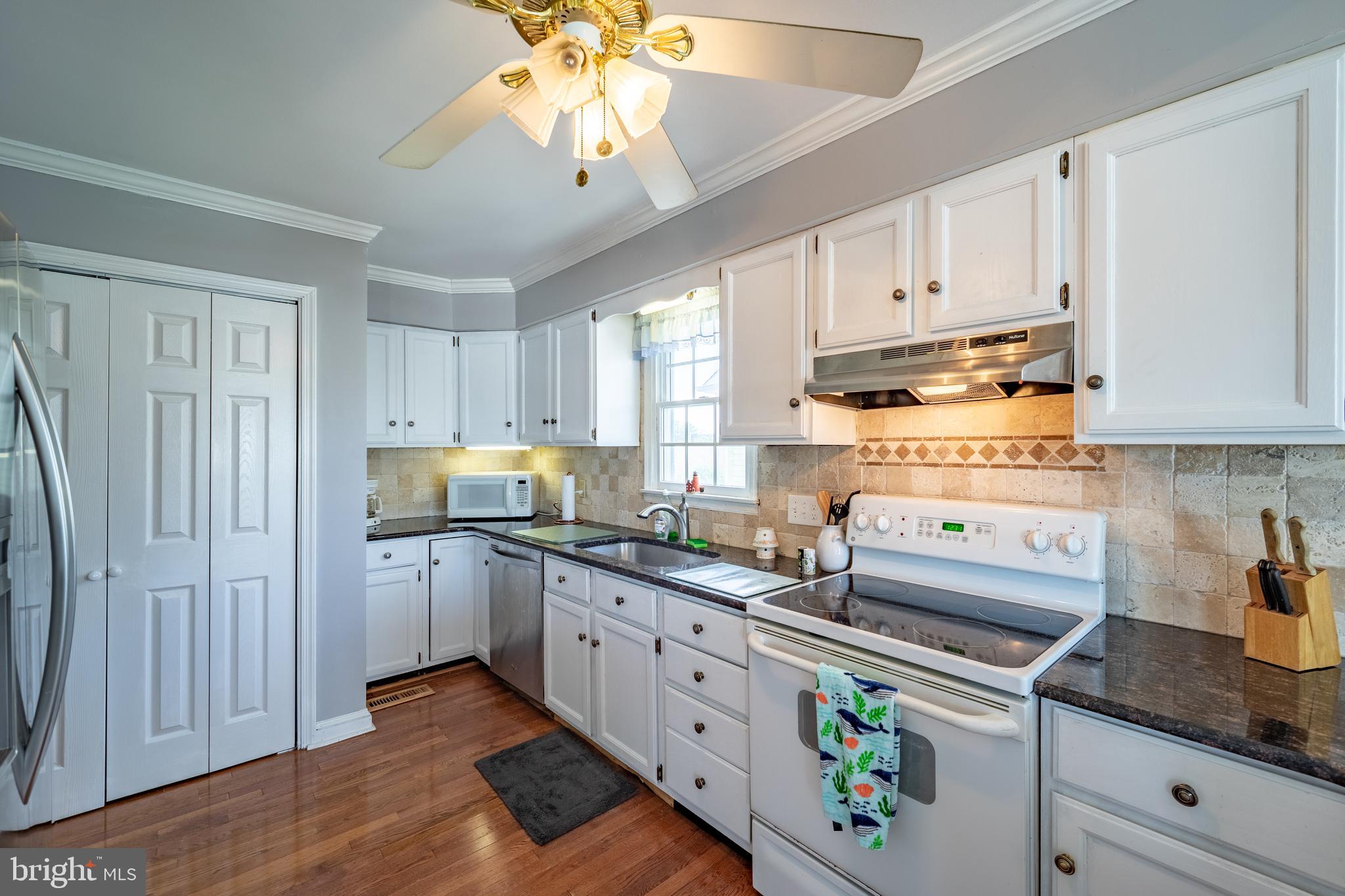 13808 Sailing Road Ocean City, MD 21842 - Photo 6 of 58 renovated kitchen with granite and tile backsplash