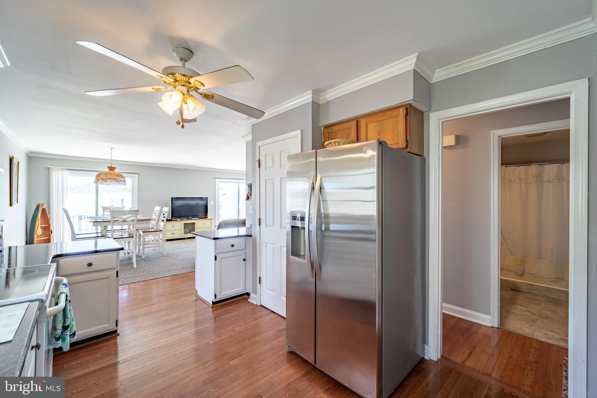 13808 Sailing Road Ocean City, MD 21842 - Photo 7 of 58 stainless refrigerator and hardwood floors