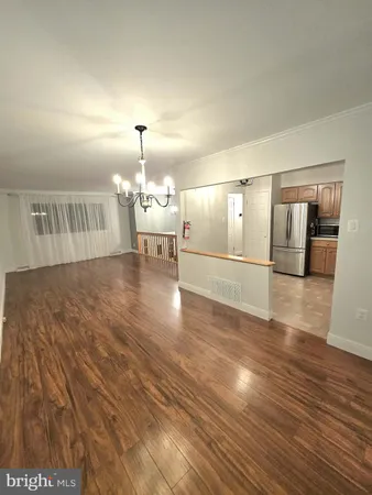 a view of a livingroom with wooden floor