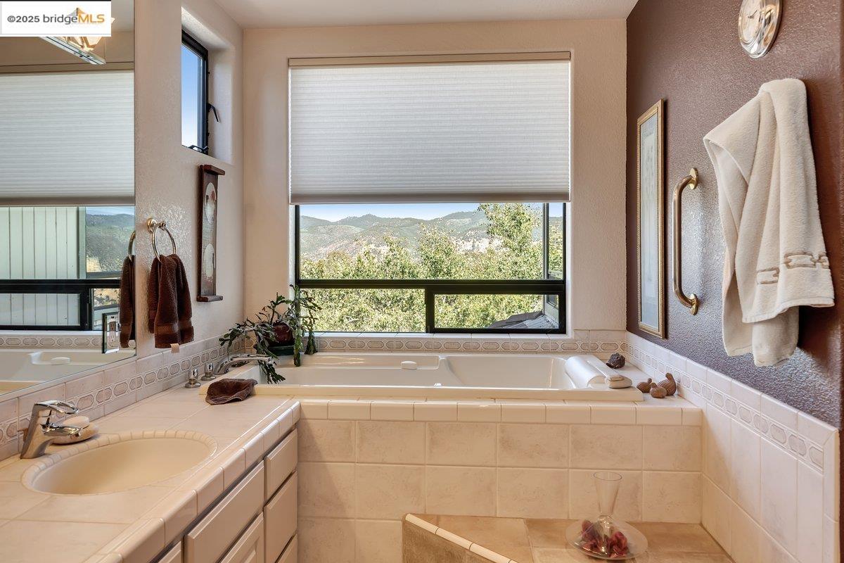 13700 Clements Road Groveland, CA 95321 - Photo 31 of 93 Bathroom with a bath and vanity