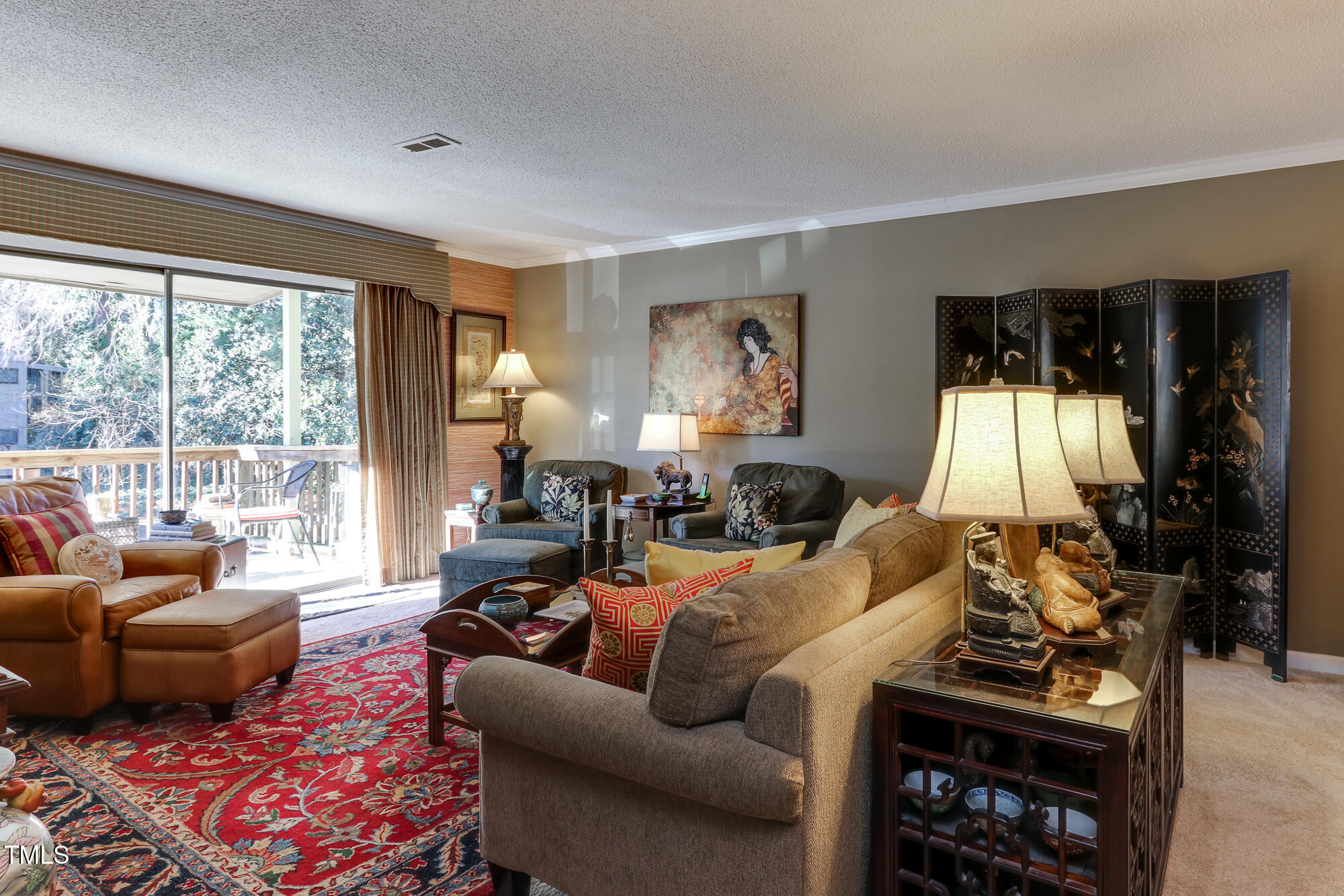615 Pine Ridge Place Raleigh, NC 27609 - Photo 3 of 22 a living room with furniture and a flat screen tv