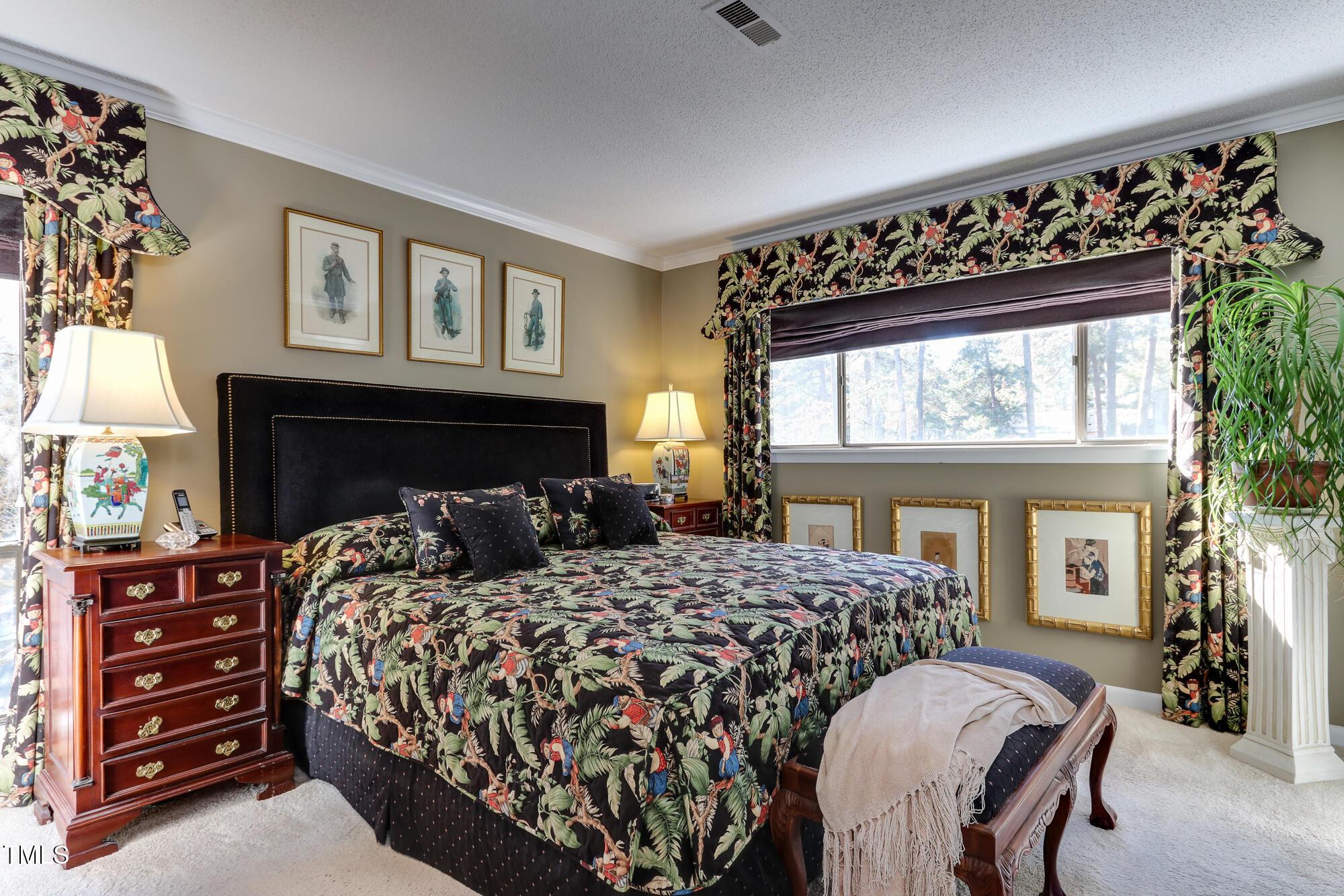 615 Pine Ridge Place Raleigh, NC 27609 - Photo 9 of 22 a bedroom with a large bed and a window