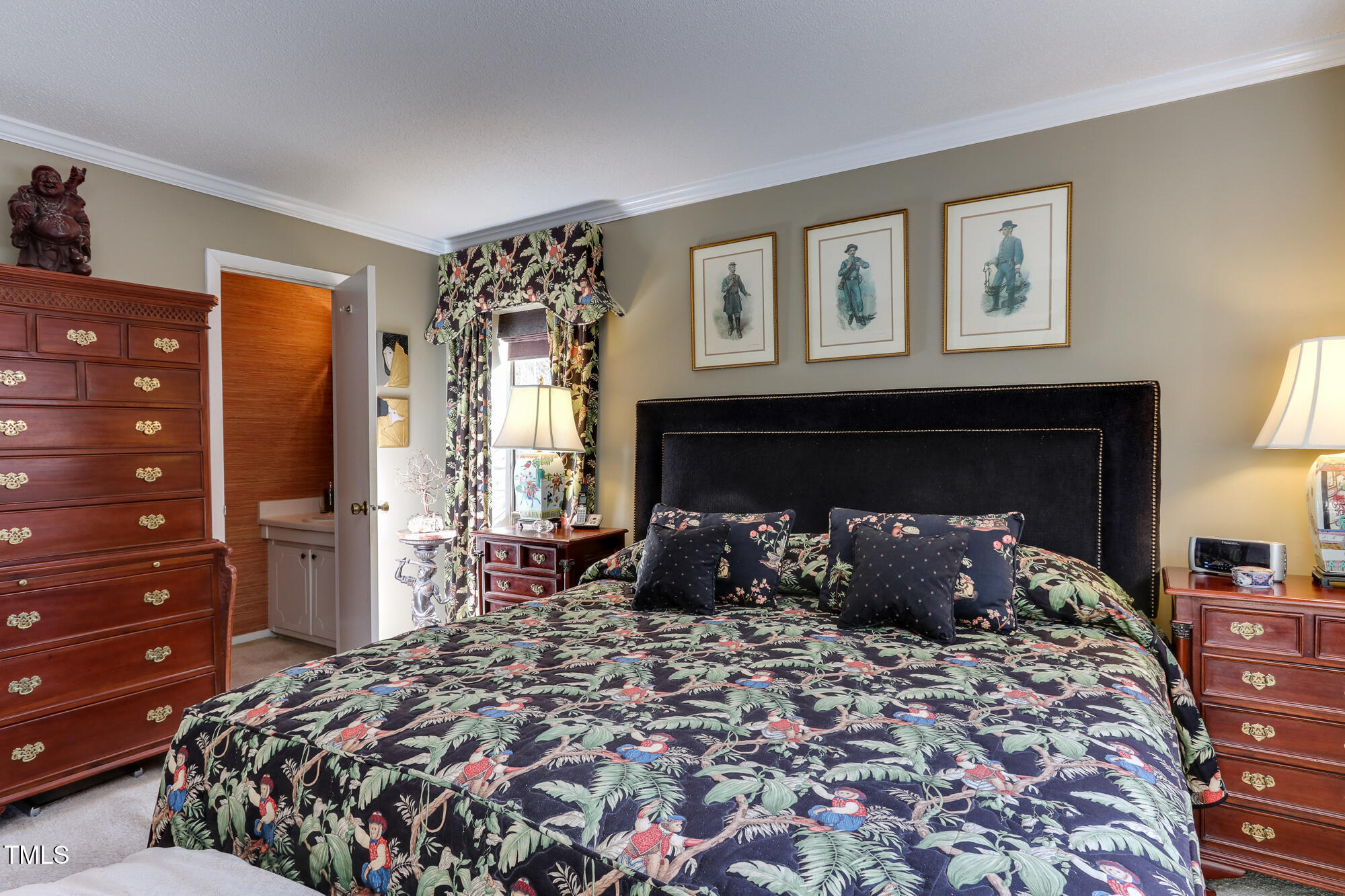 615 Pine Ridge Place Raleigh, NC 27609 - Photo 10 of 22 a bedroom with a large bed and a tv