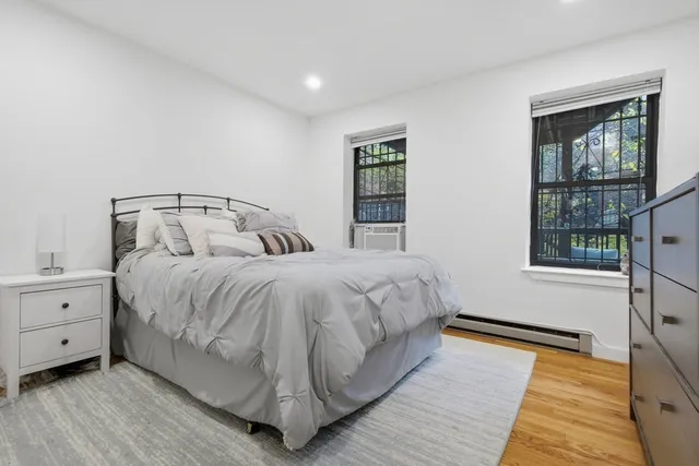 a bedroom with a bed and window
