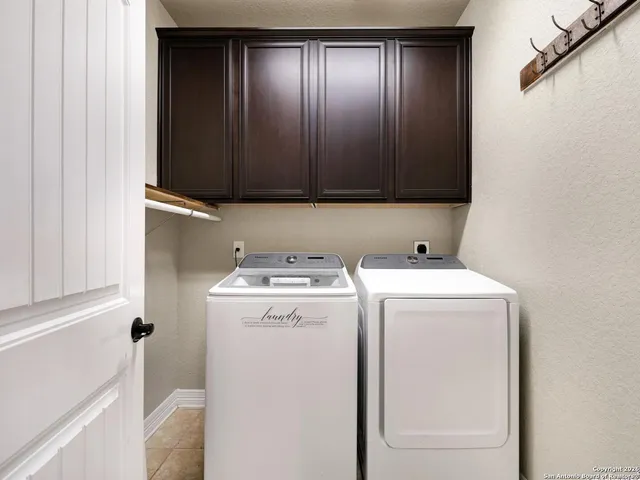 a view of storage and utility room with washer and dryer