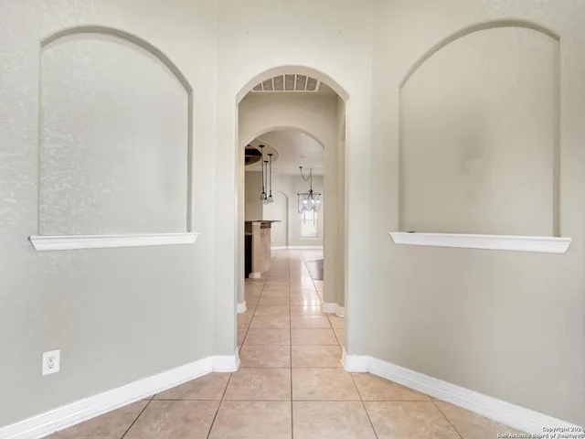 a view of a hallway with a bathroom