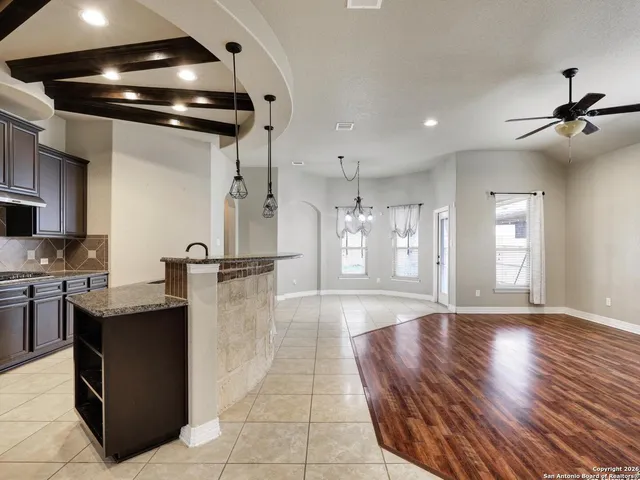 a lobby with furniture and chandelier
