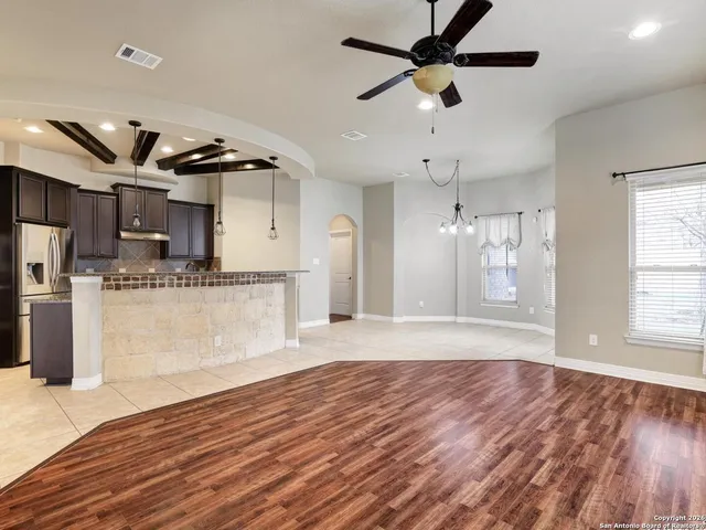 a view of kitchen with cabinets and wooden floor