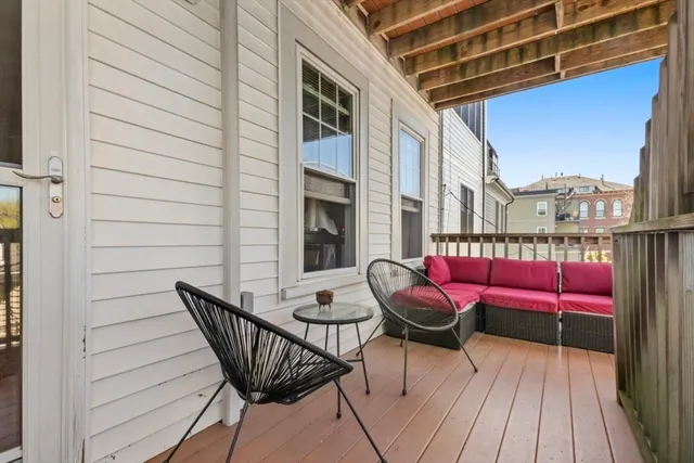 a view of balcony with furniture