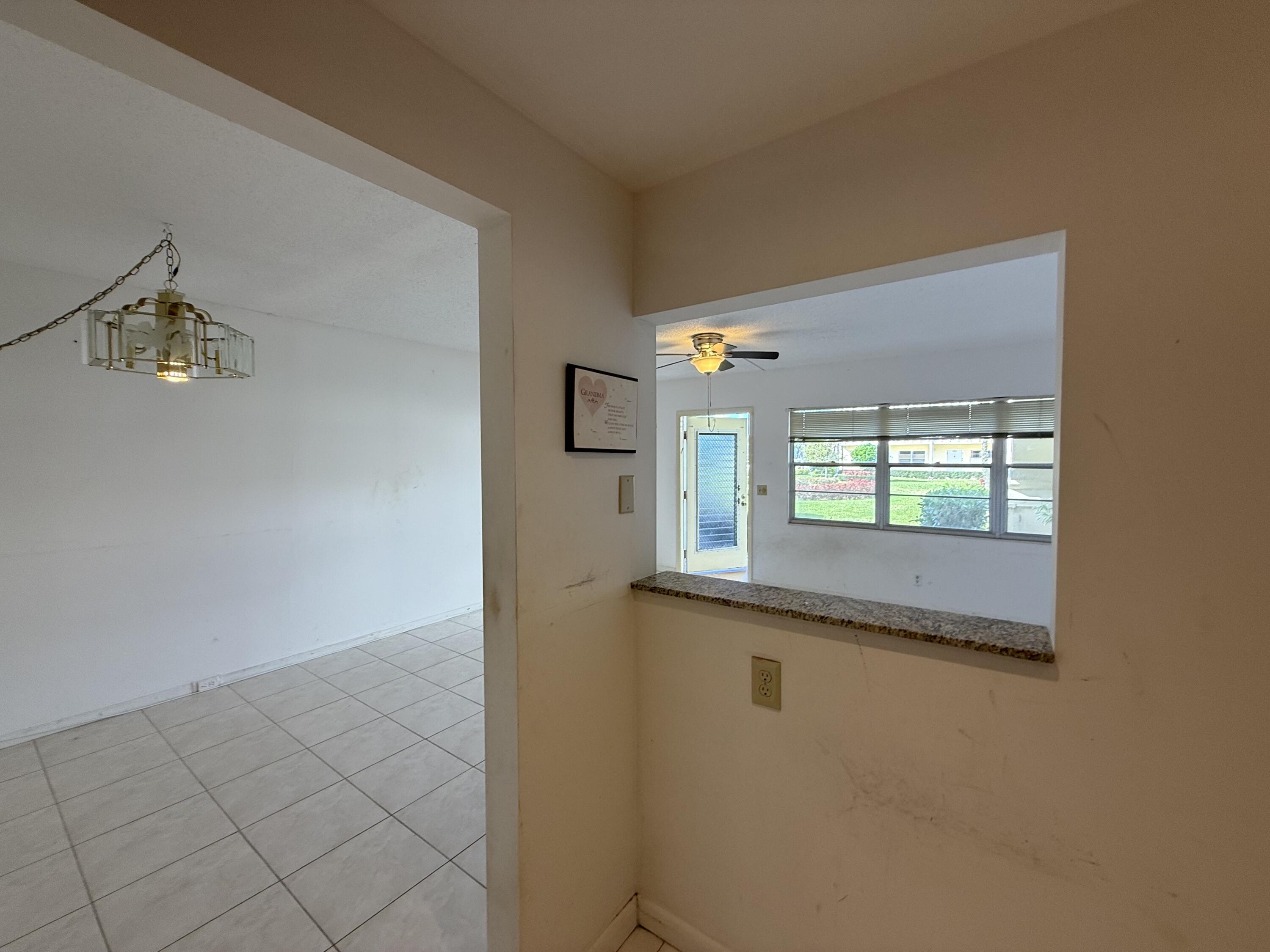 13 Dorset A Boca Raton, FL 33434 - Photo 14 of 69 a view of a hallway to a window