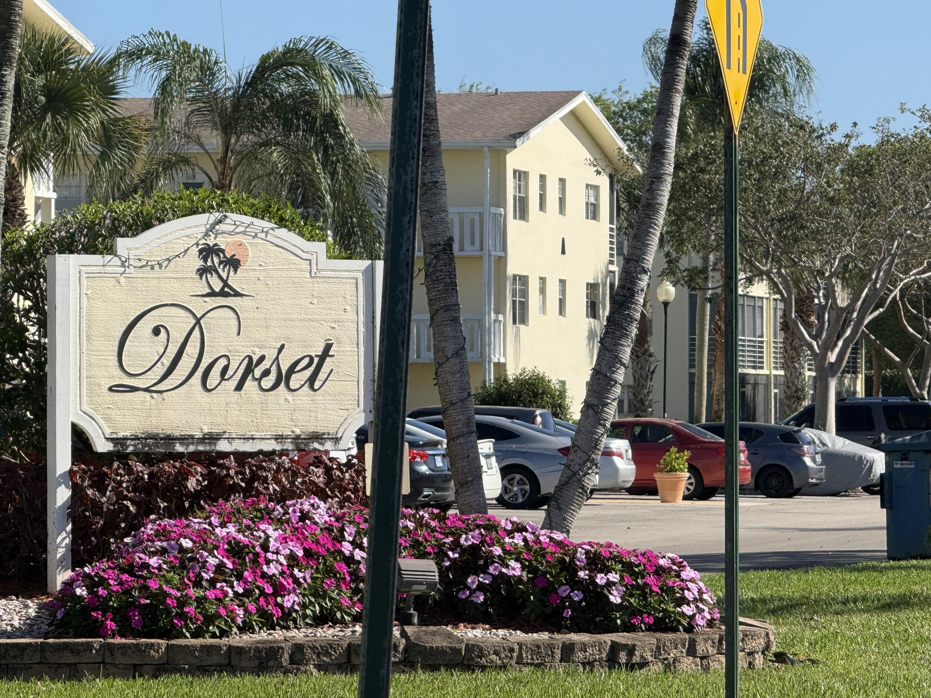 13 Dorset A Boca Raton, FL 33434 - Photo 2 of 69 a view of front of a house with a yard and fountain