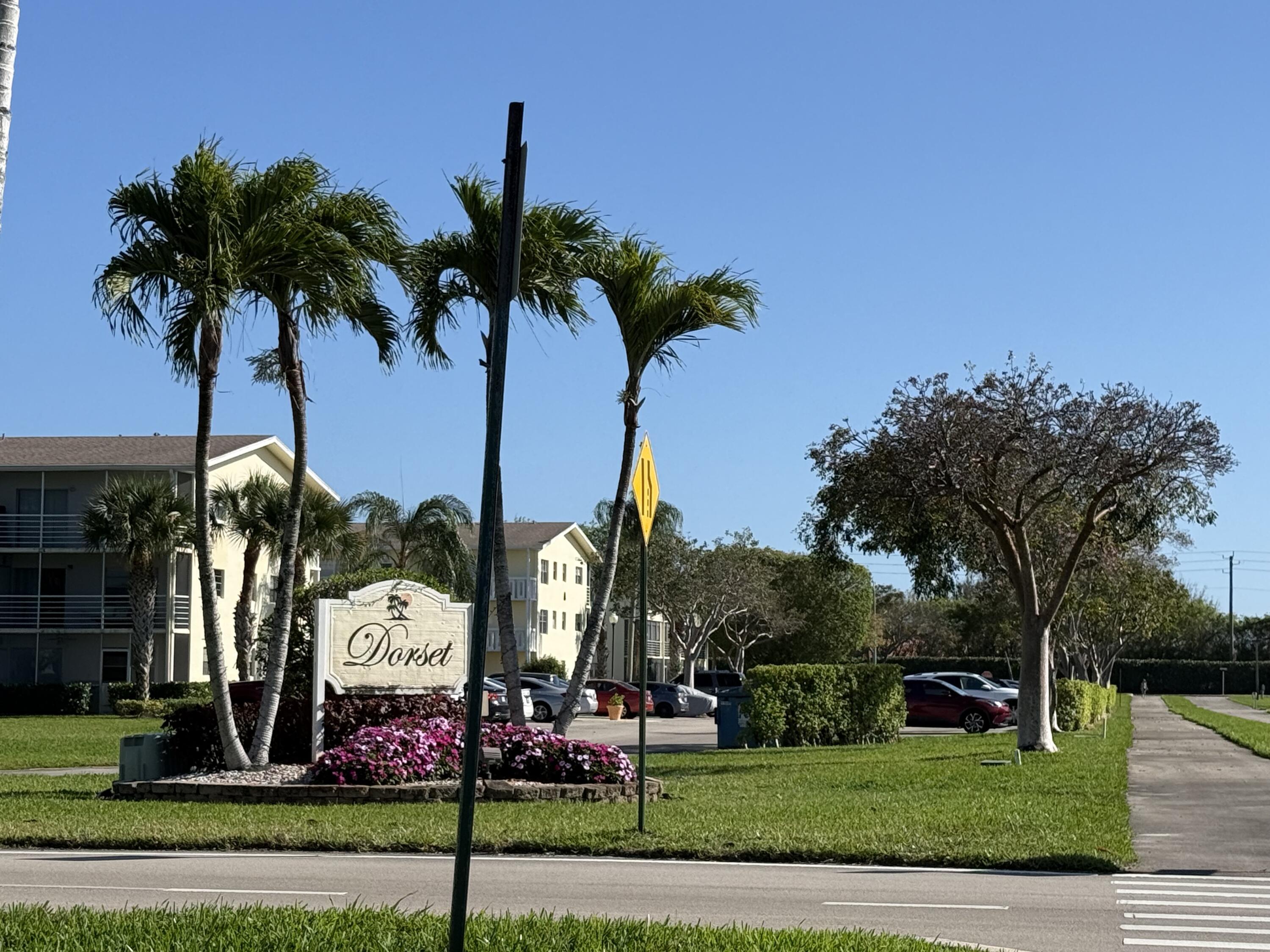13 Dorset A Boca Raton, FL 33434 - Photo 3 of 69 a sign board with palm trees