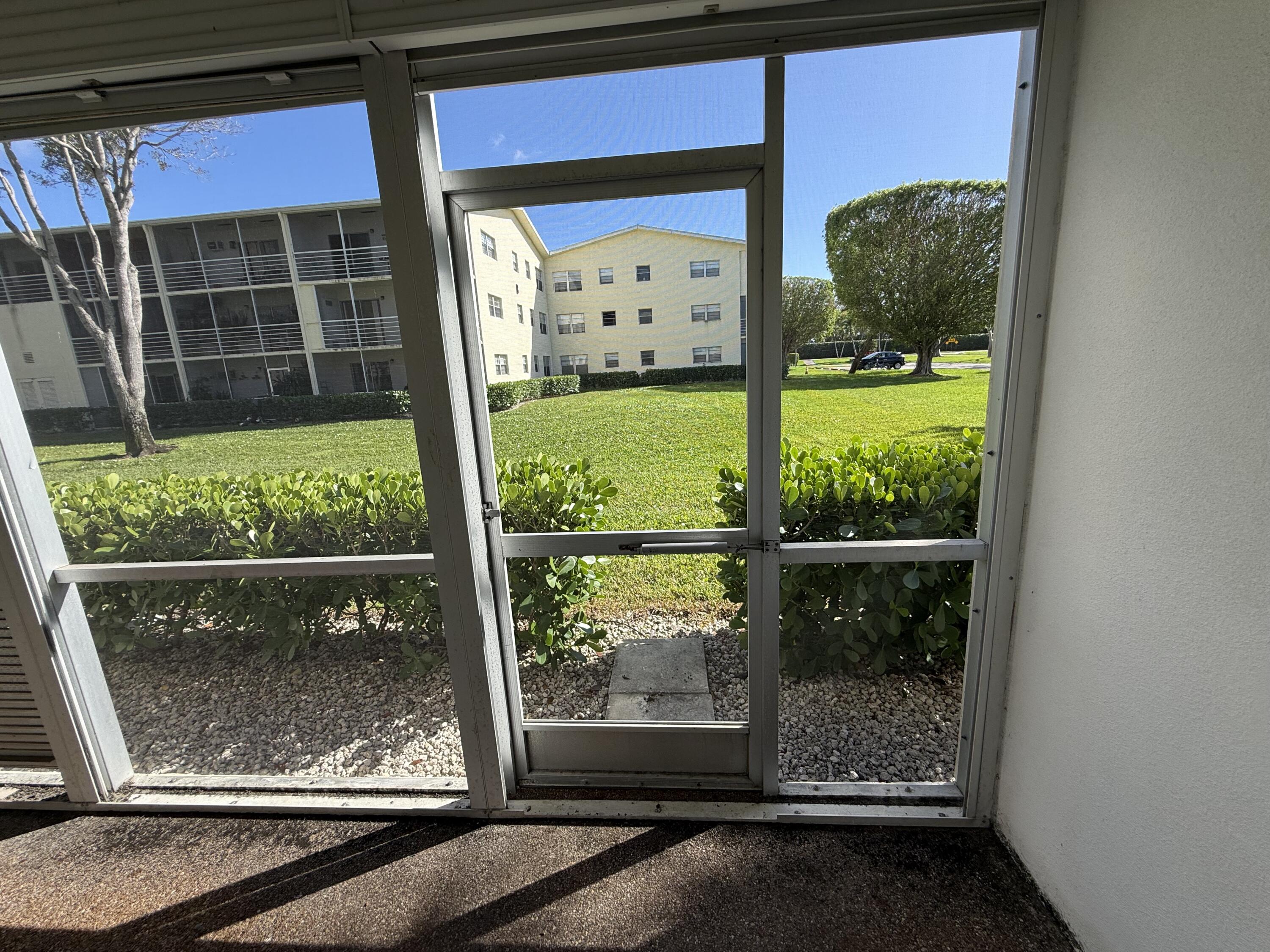 13 Dorset A Boca Raton, FL 33434 - Photo 33 of 69 a view of a glass door with a door