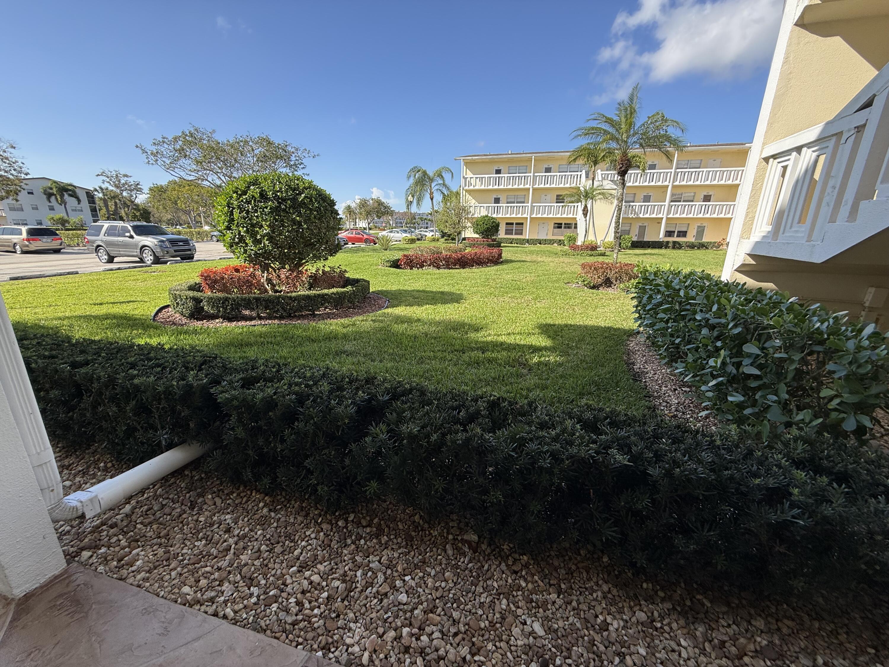 13 Dorset A Boca Raton, FL 33434 - Photo 36 of 69 a view of a big yard with plants and large trees