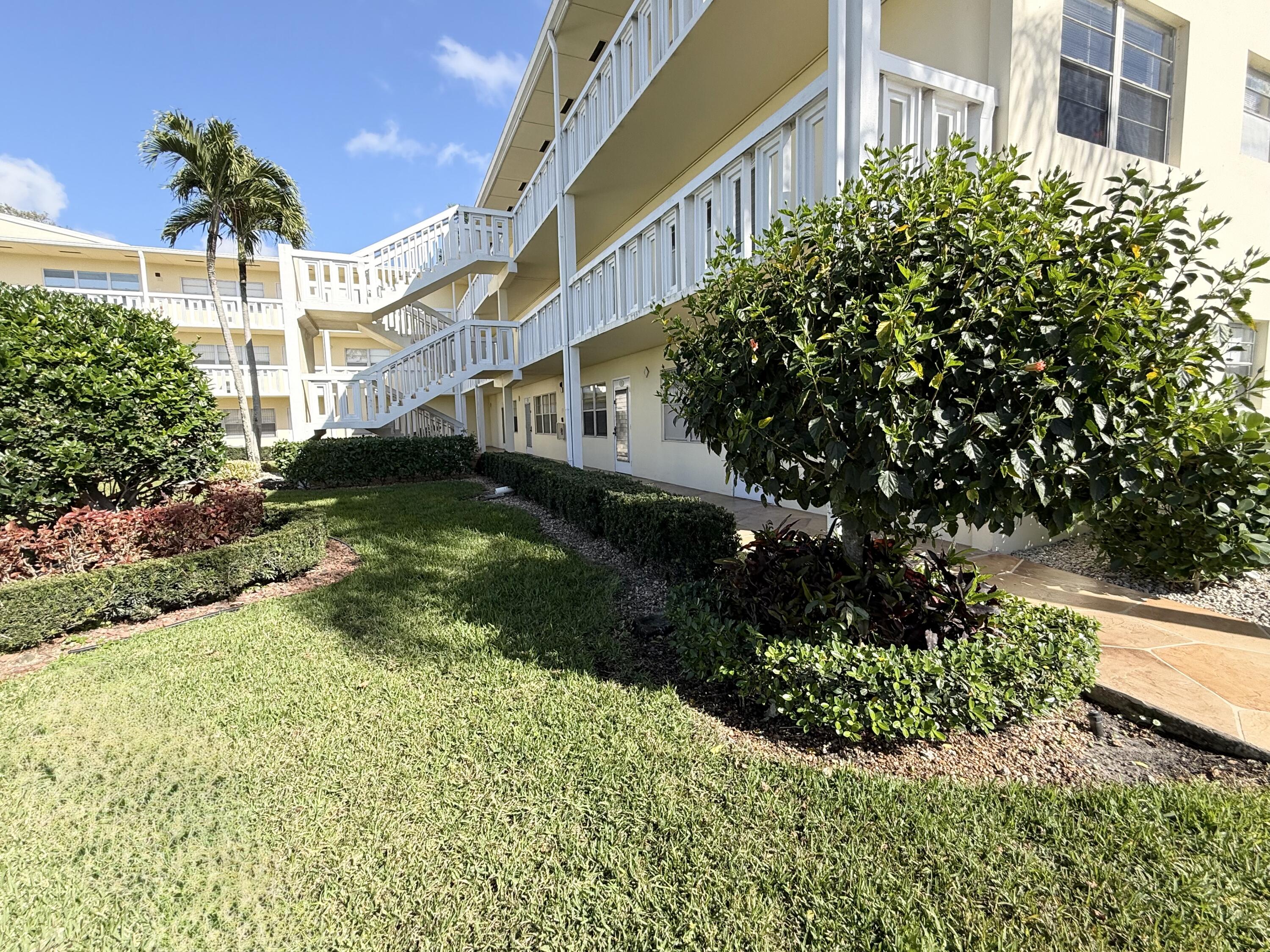13 Dorset A Boca Raton, FL 33434 - Photo 8 of 69 a view of a garden with a building